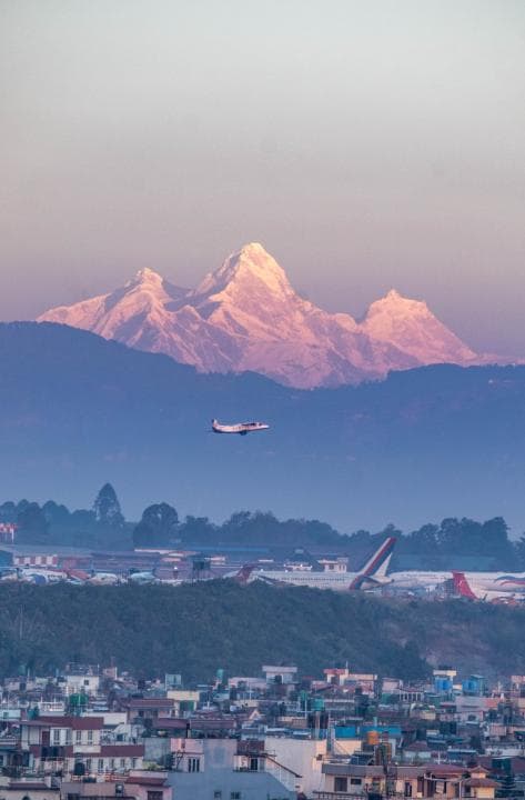 Plane along the mountain